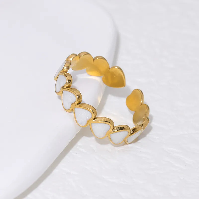 White resin gold plated heart ring