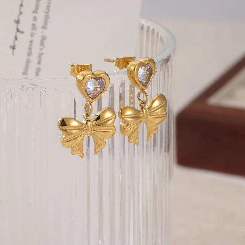 Bow drop heart zirconia gold studs