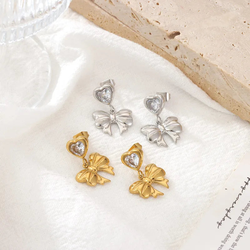 Bow drop heart zirconia gold studs