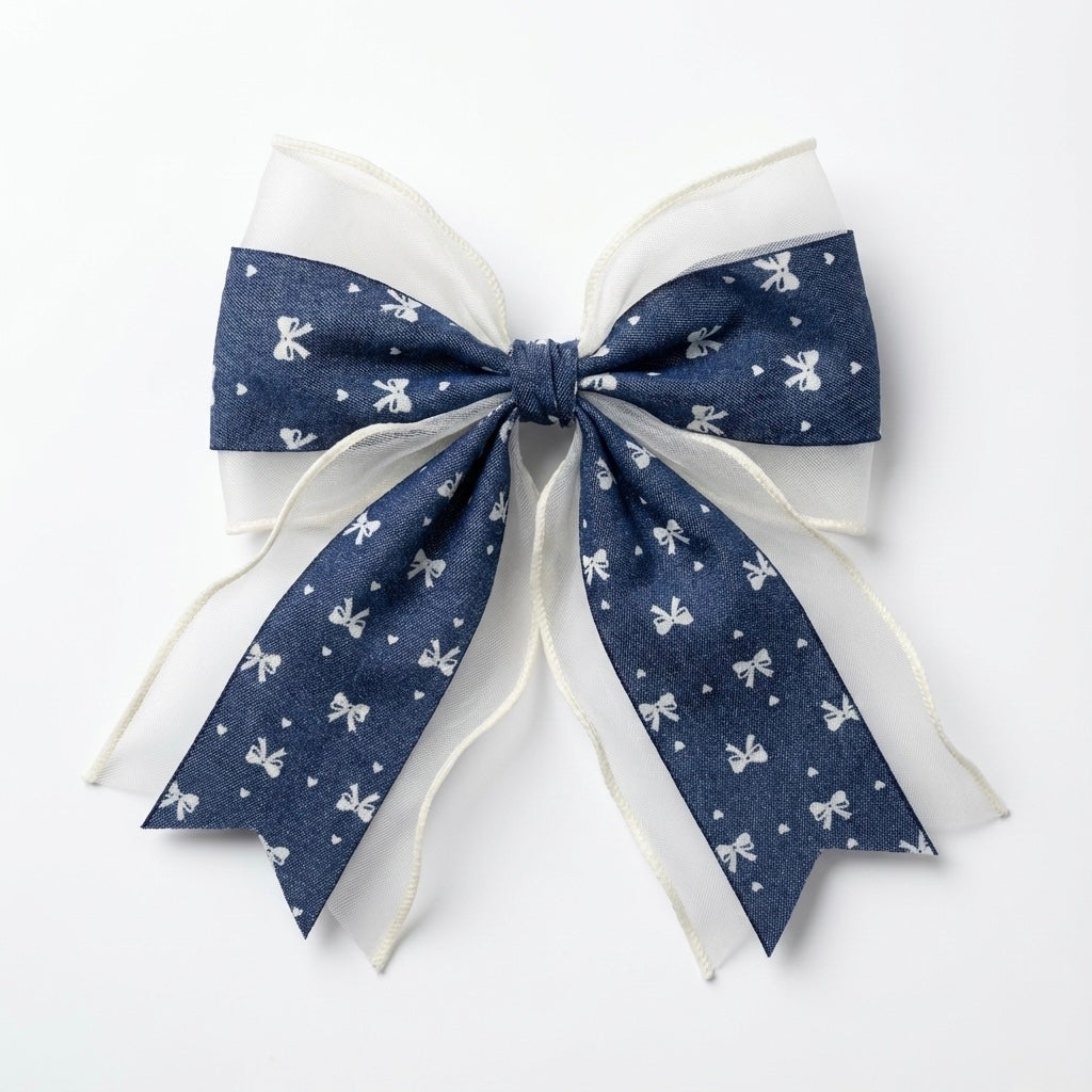 Navy blue bow with white patterns on a white background