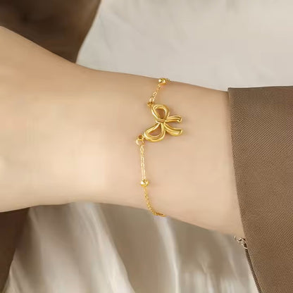 Charm knot bow gold bracelet