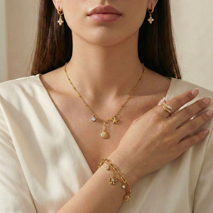 Zircon Brilliance Suite | Floral Earrings, Bow Bracelet, Charm Necklace & Pavé Ring