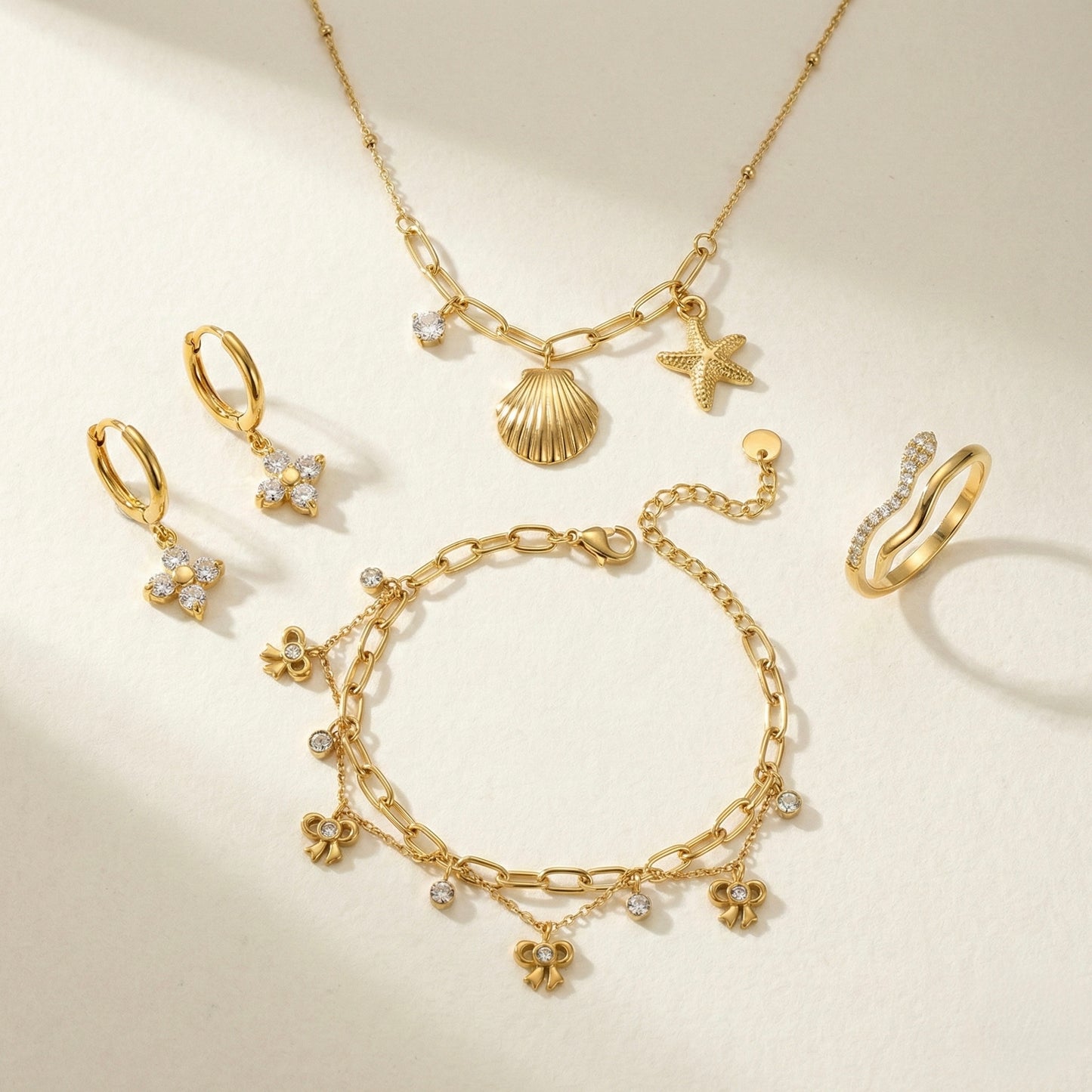 Zircon Brilliance Suite | Floral Earrings, Bow Bracelet, Charm Necklace & Pavé Ring