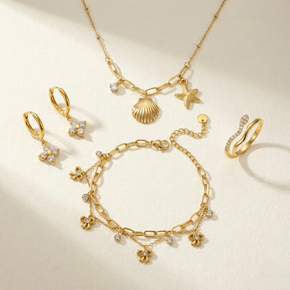 Zircon Brilliance Suite | Floral Earrings, Bow Bracelet, Charm Necklace & Pavé Ring