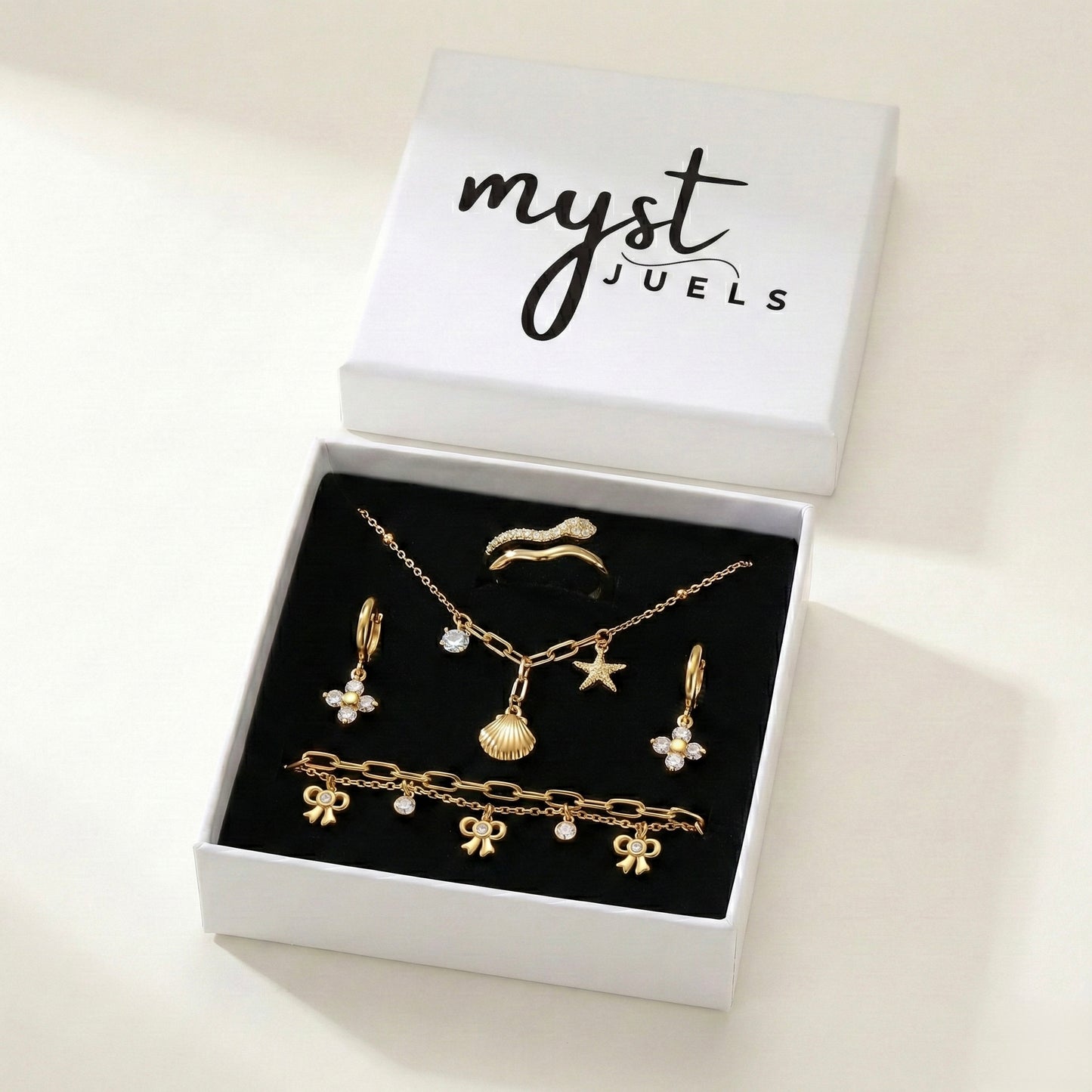 Zircon Brilliance Suite | Floral Earrings, Bow Bracelet, Charm Necklace & Pavé Ring