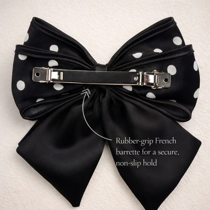 Back view of black hair bow showing rubber grip french barrette