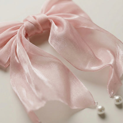 Close up of blush pink organza fabric hair bow