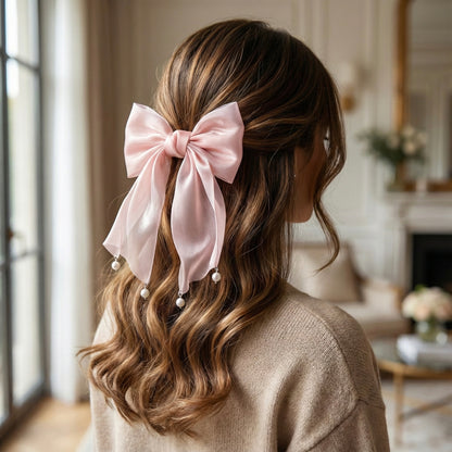 Blush pink organza hair bow worn on hair