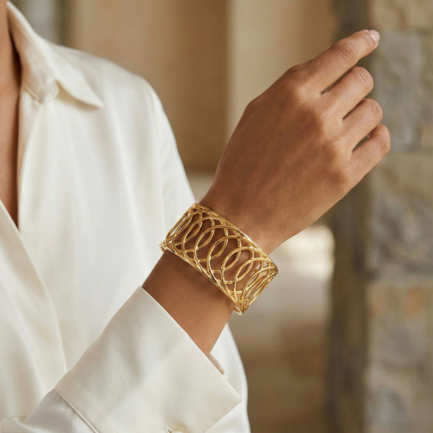 Gold lattice cuff bracelet on wrist