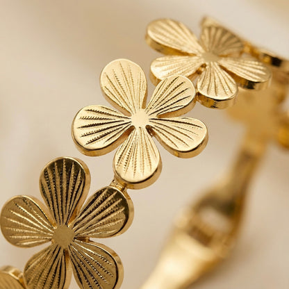 Golden floral cuff bracelet with embossed petal detailing – Mystjuels luxury jewelry