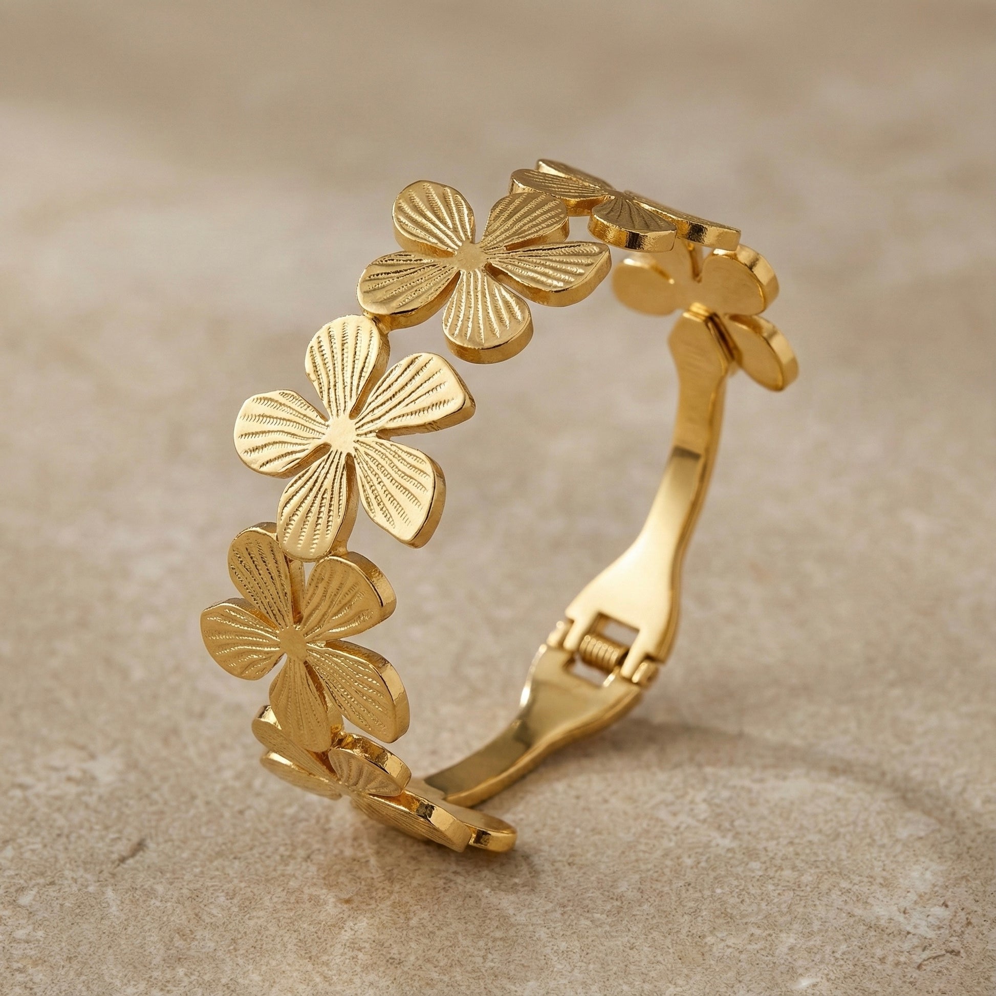 Golden floral cuff bracelet with embossed petal detailing – Mystjuels luxury jewelry