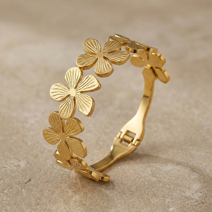 Golden floral cuff bracelet with embossed petal detailing – Mystjuels luxury jewelry