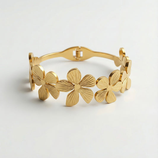 “Golden floral cuff bracelet with embossed petal detailing – Mystjuels luxury jewelry”