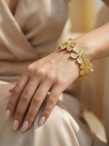 Golden floral cuff bracelet with embossed petal detailing – Mystjuels luxury jewelry
