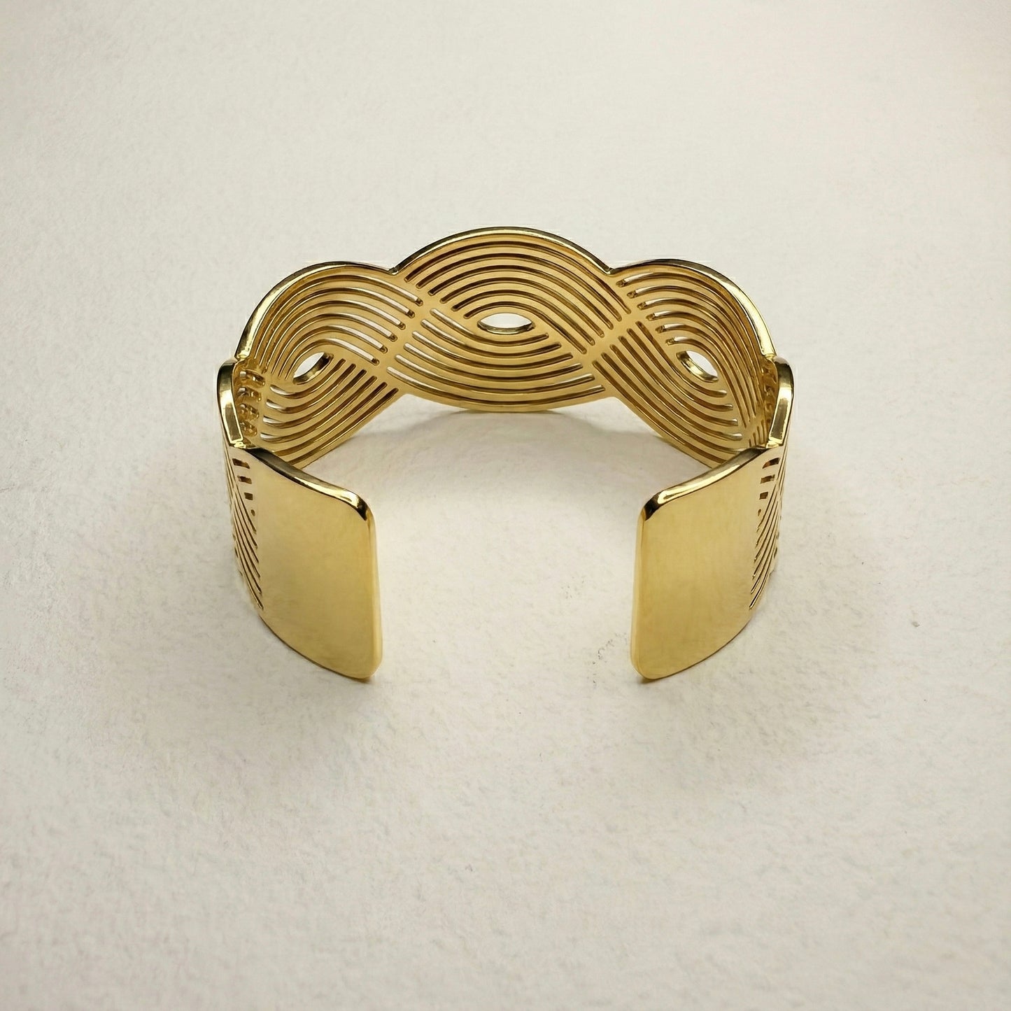 infinity wave gold cuff bracelet with sculptural cut-out design – Mystjuels