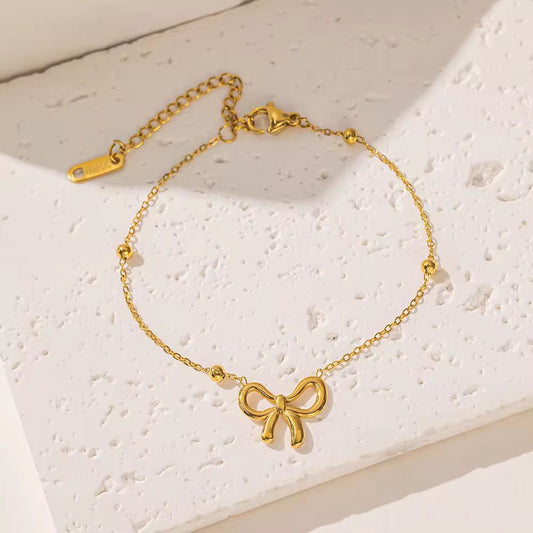 Charm knot bow gold bracelet