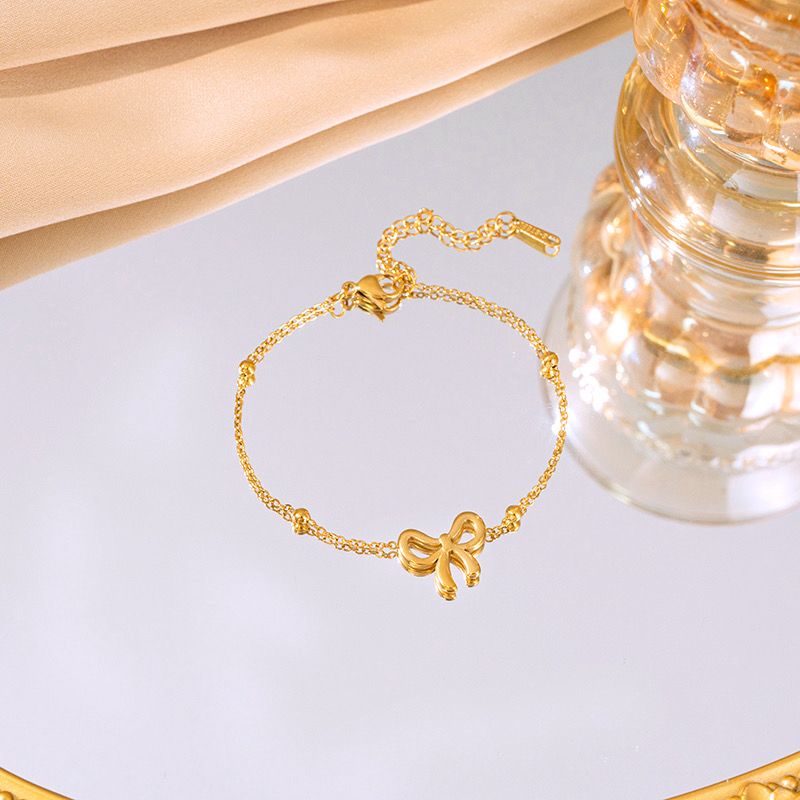 Charm knot bow gold bracelet